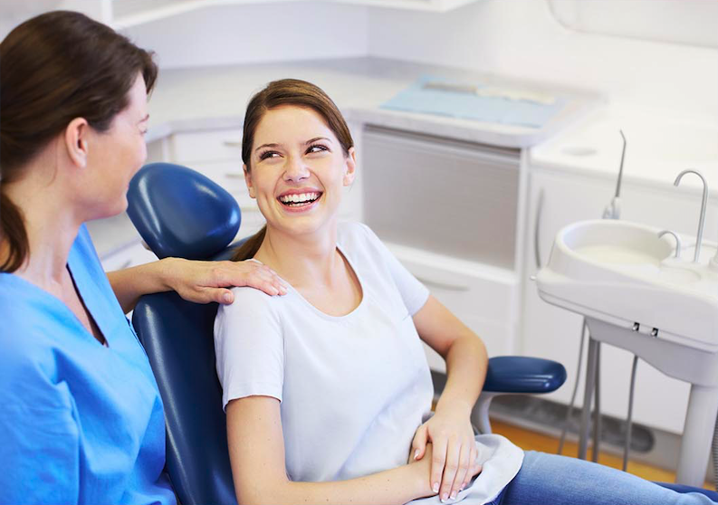 Woman smiling after dental implant
